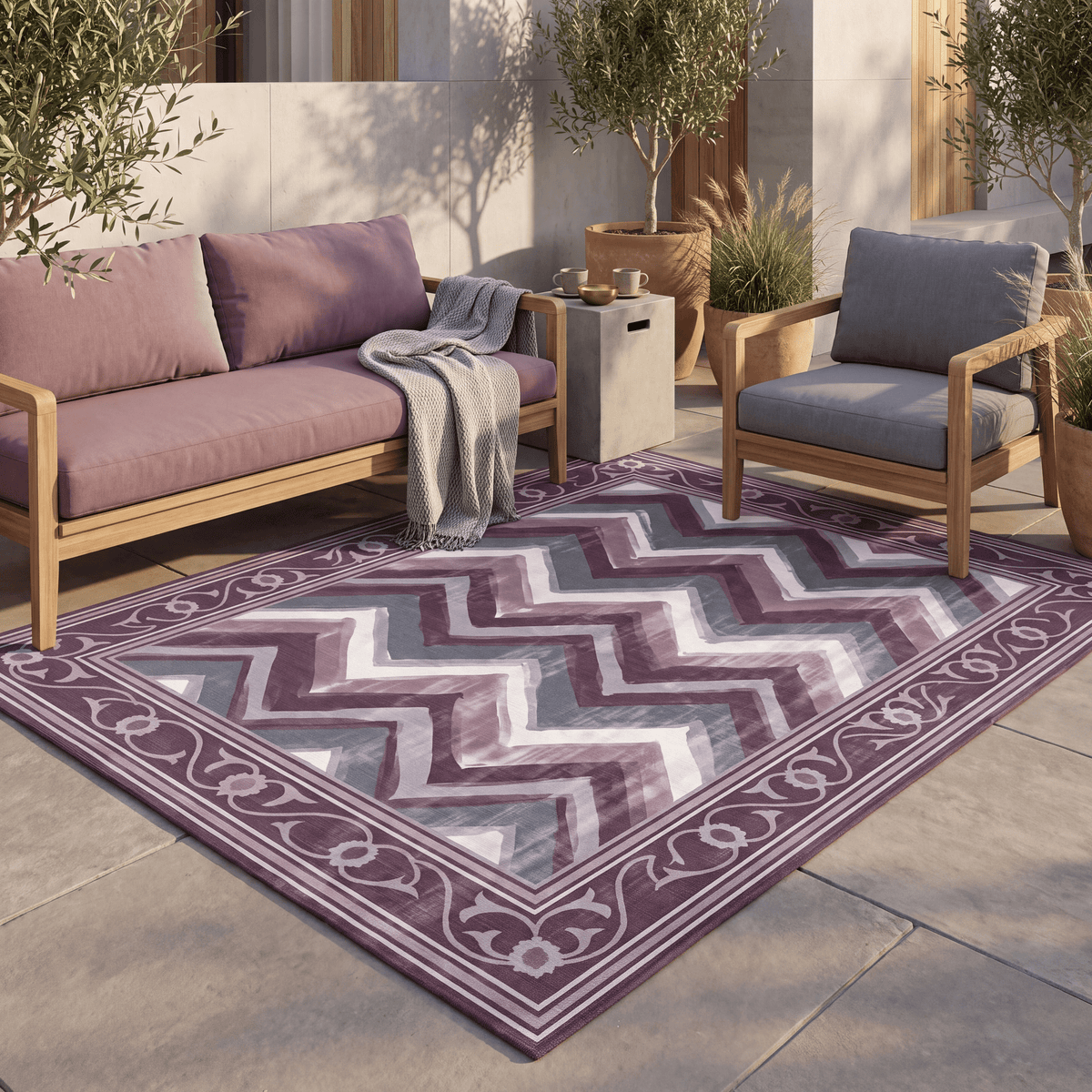The rug laid flat on a patio beside outdoor seating.