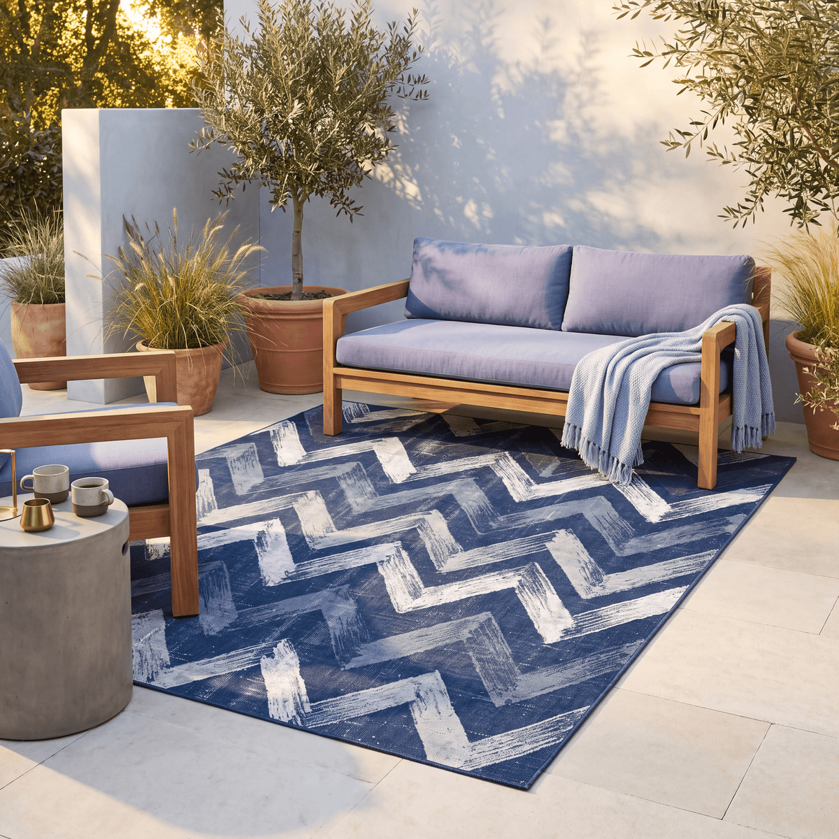 The rug laid flat on a patio beside outdoor seating.