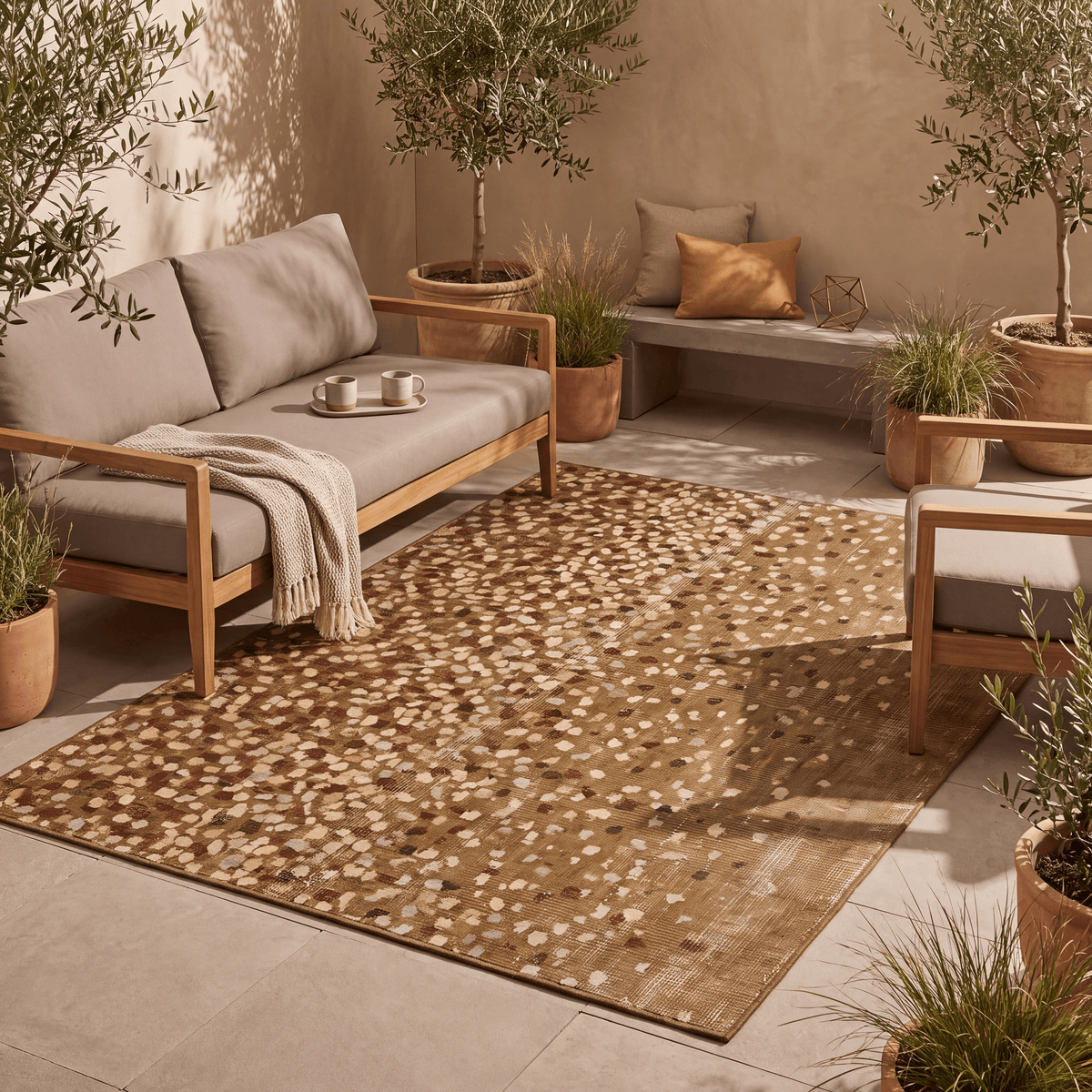The rug laid flat on a patio beside outdoor seating.