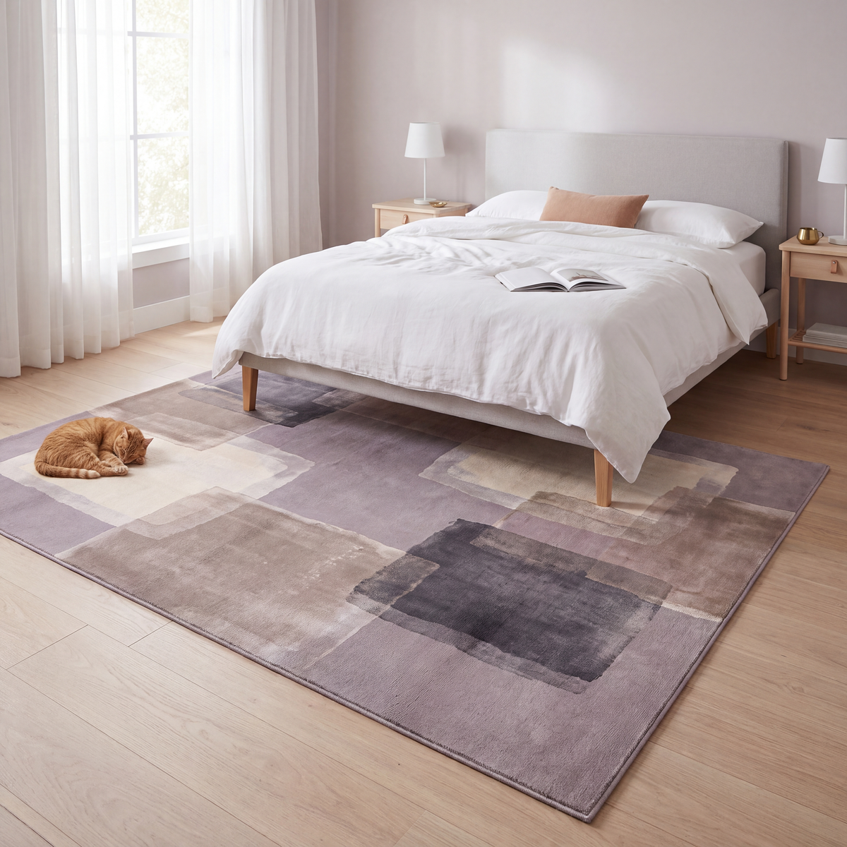 The rug at the foot of a bed with a cat asleep on it.
