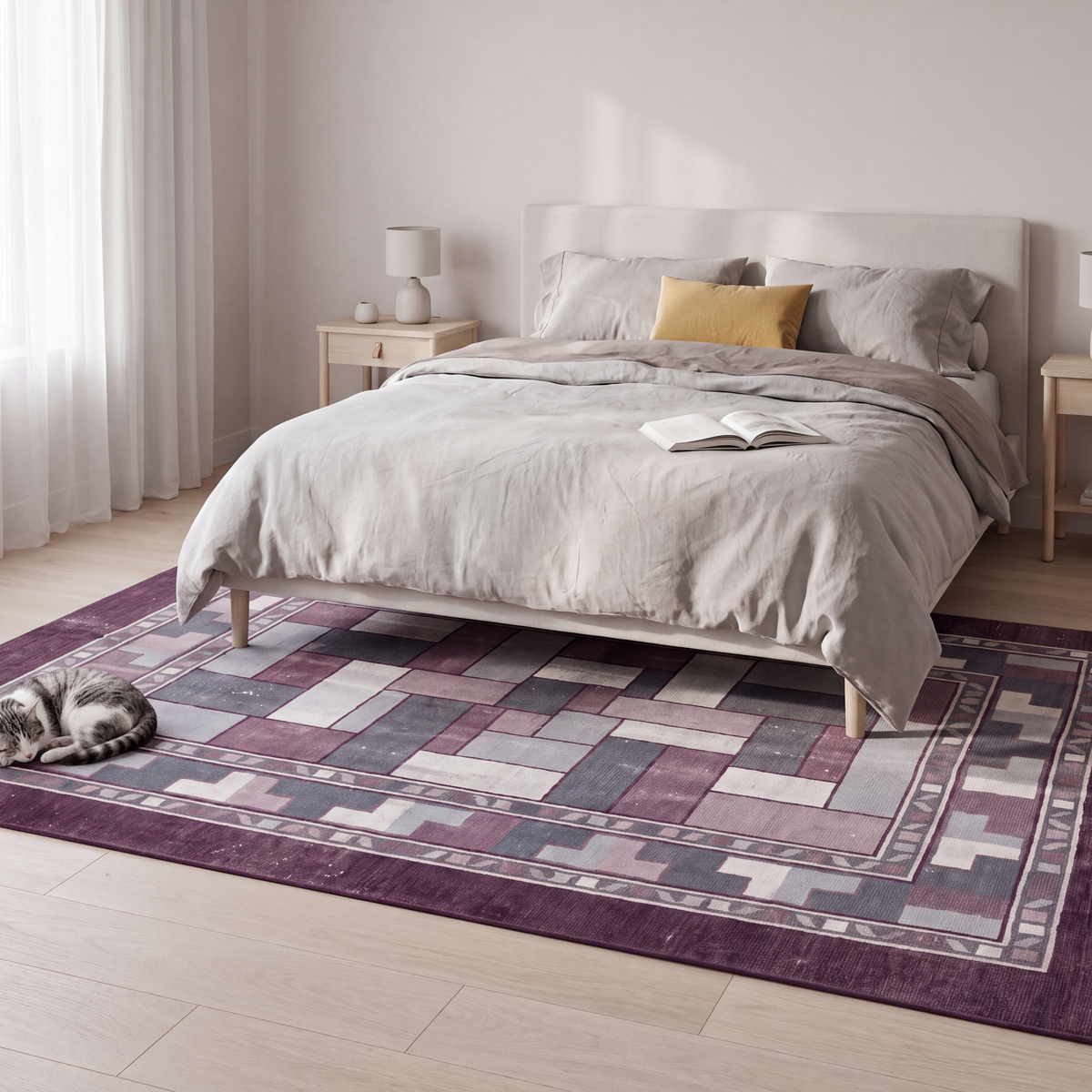The rug at the foot of a bed with a cat asleep on it.