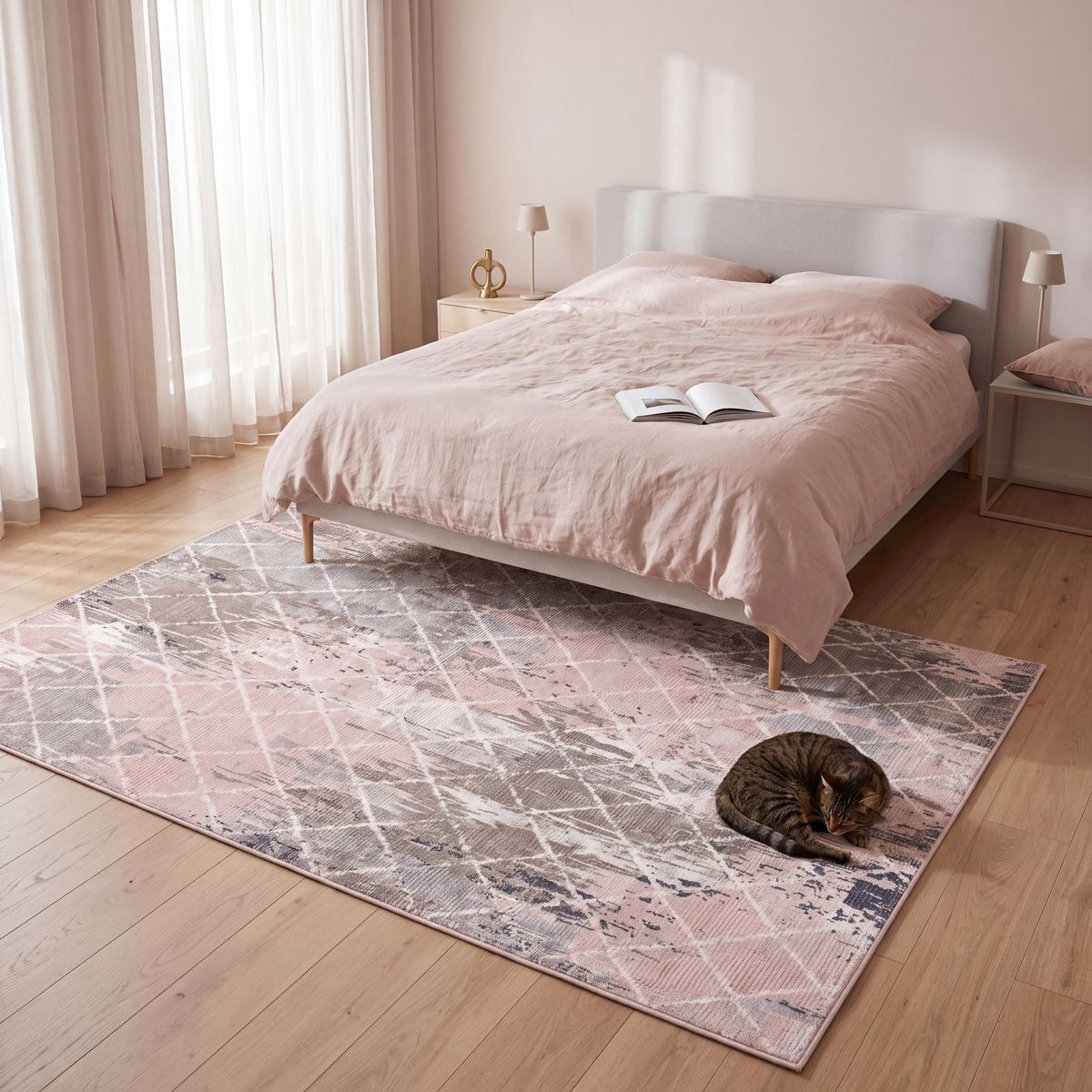 The rug at the foot of a bed with a cat asleep on it.