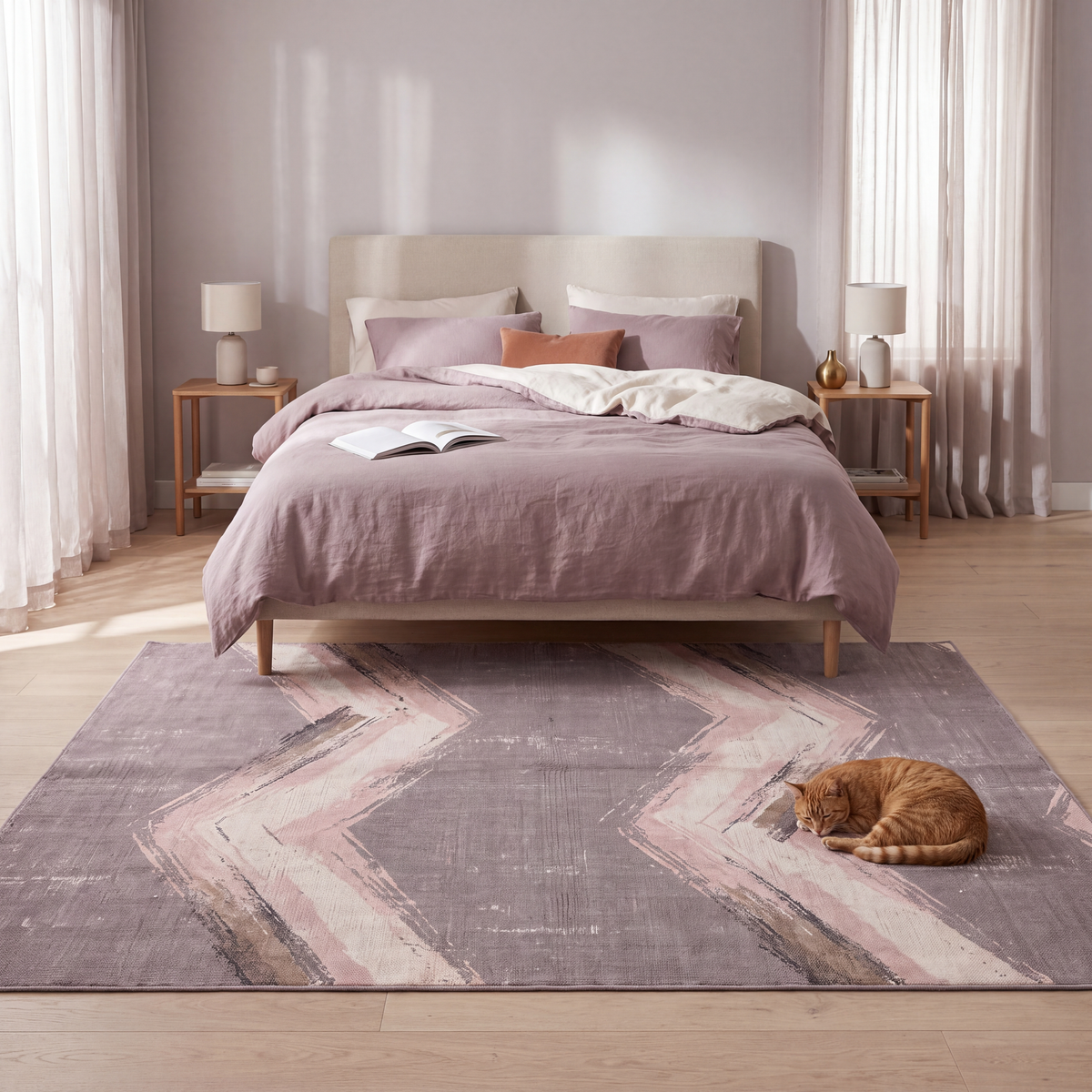 The rug at the foot of a bed with a cat asleep on it.