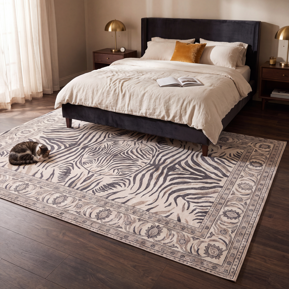 The rug at the foot of a bed with a cat asleep on it.