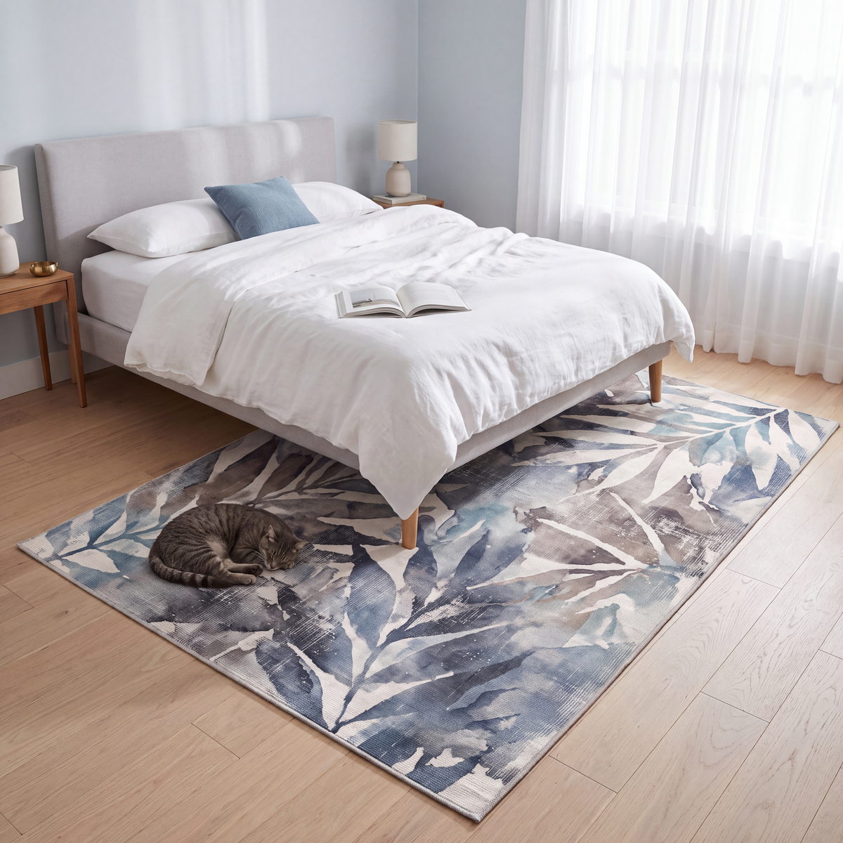 The rug at the foot of a bed with a cat asleep on it.
