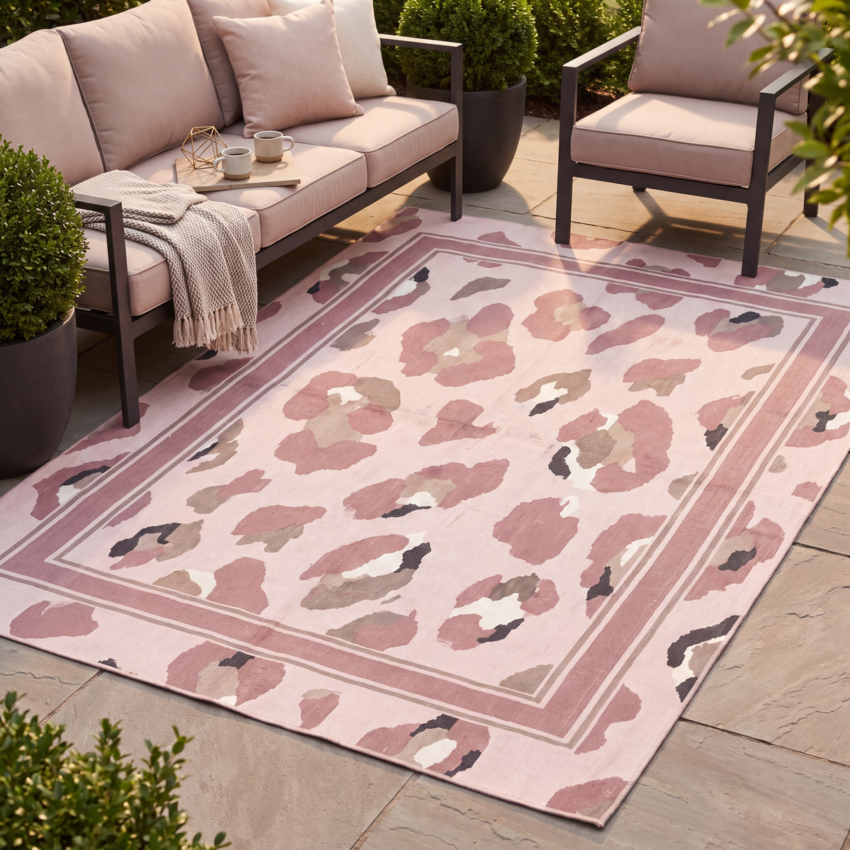 The rug laid flat on a patio beside outdoor seating.