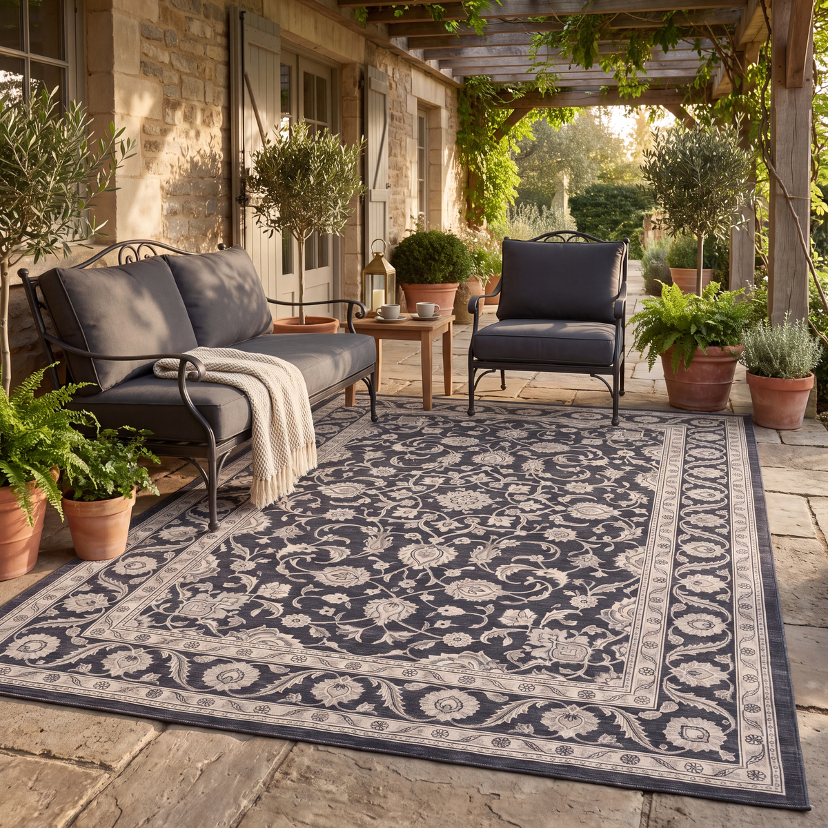The rug laid flat on a patio beside outdoor seating.