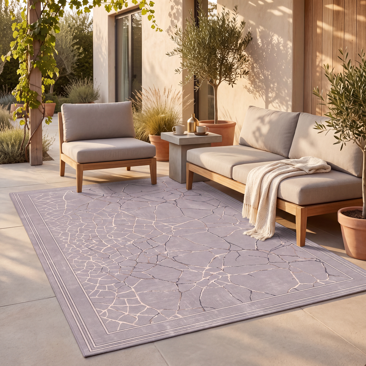 The rug laid flat on a patio beside outdoor seating.