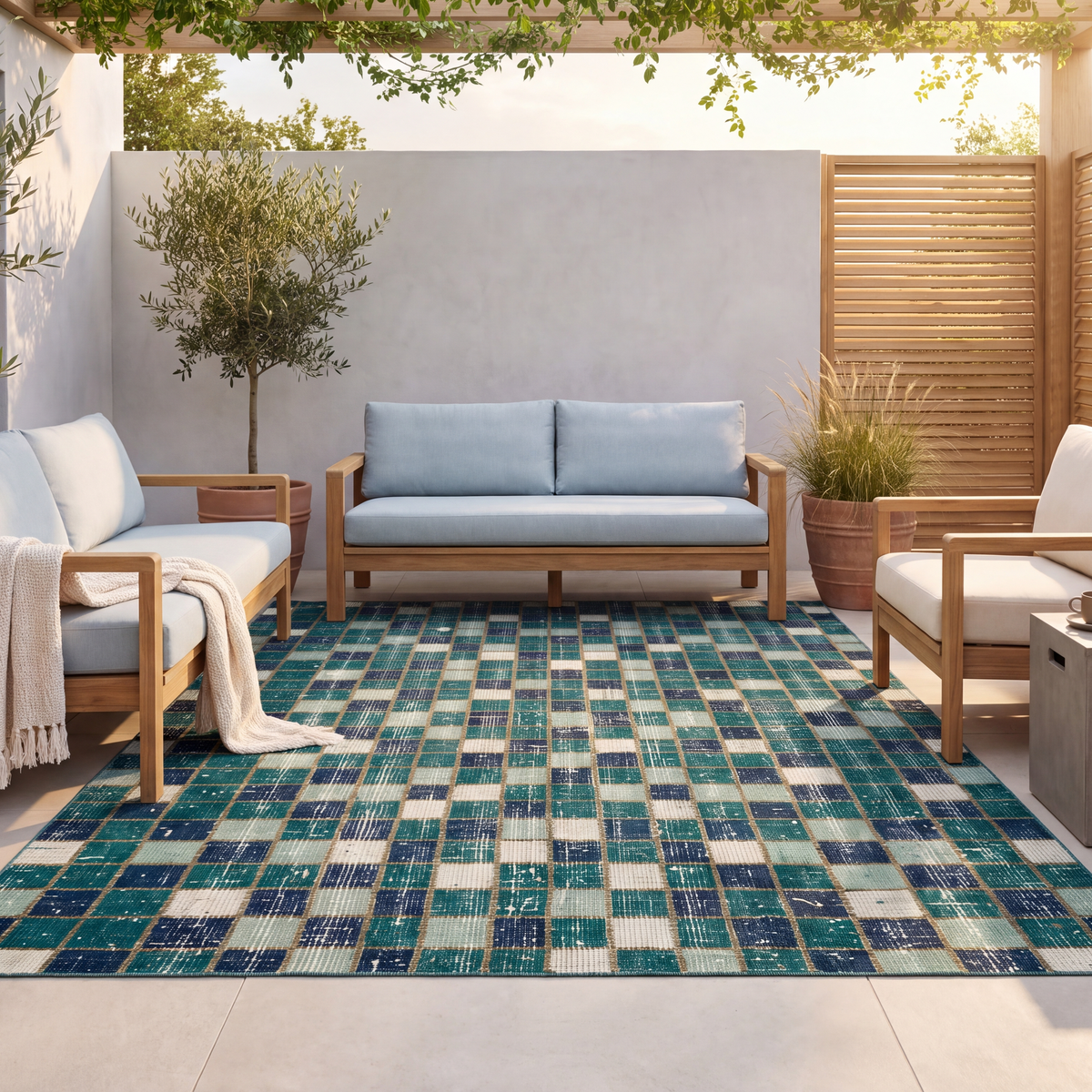 The rug laid flat on a patio beside outdoor seating.