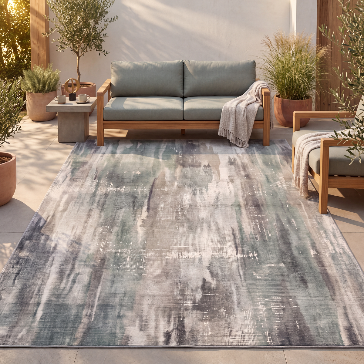 The rug laid flat on a patio beside outdoor seating.