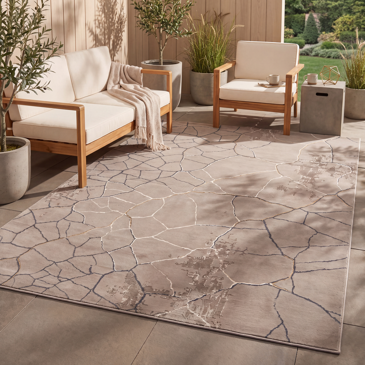 The rug laid flat on a patio beside outdoor seating.