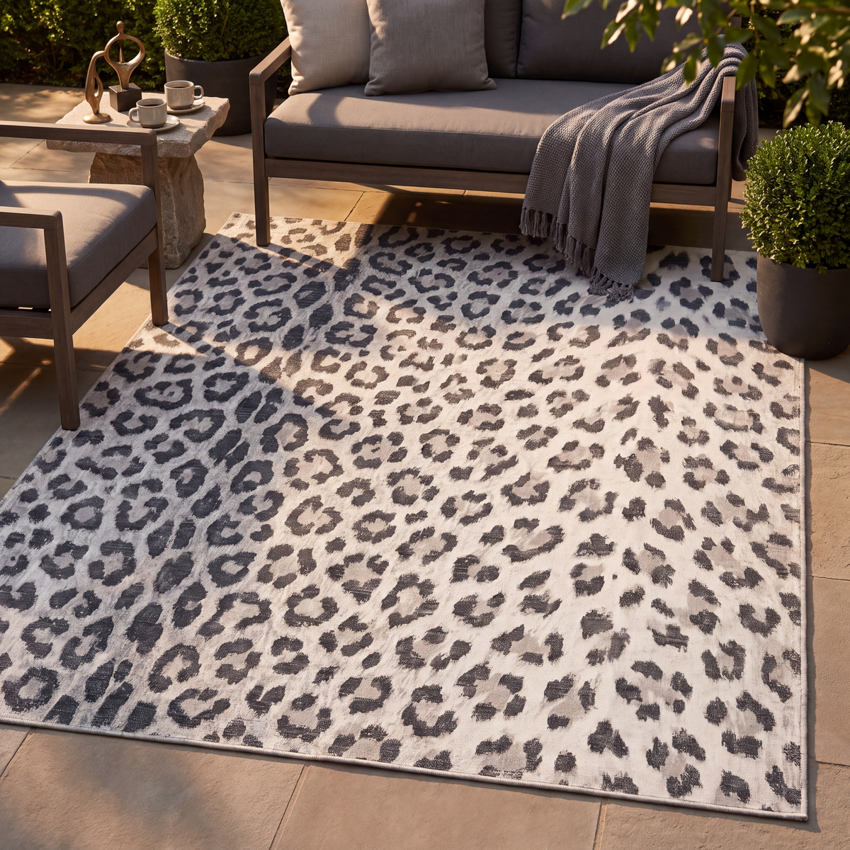 The rug laid flat on a patio beside outdoor seating.