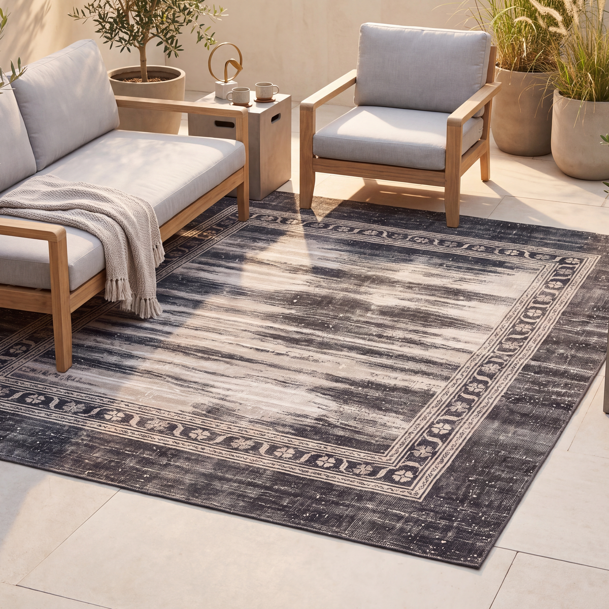 The rug laid flat on a patio beside outdoor seating.