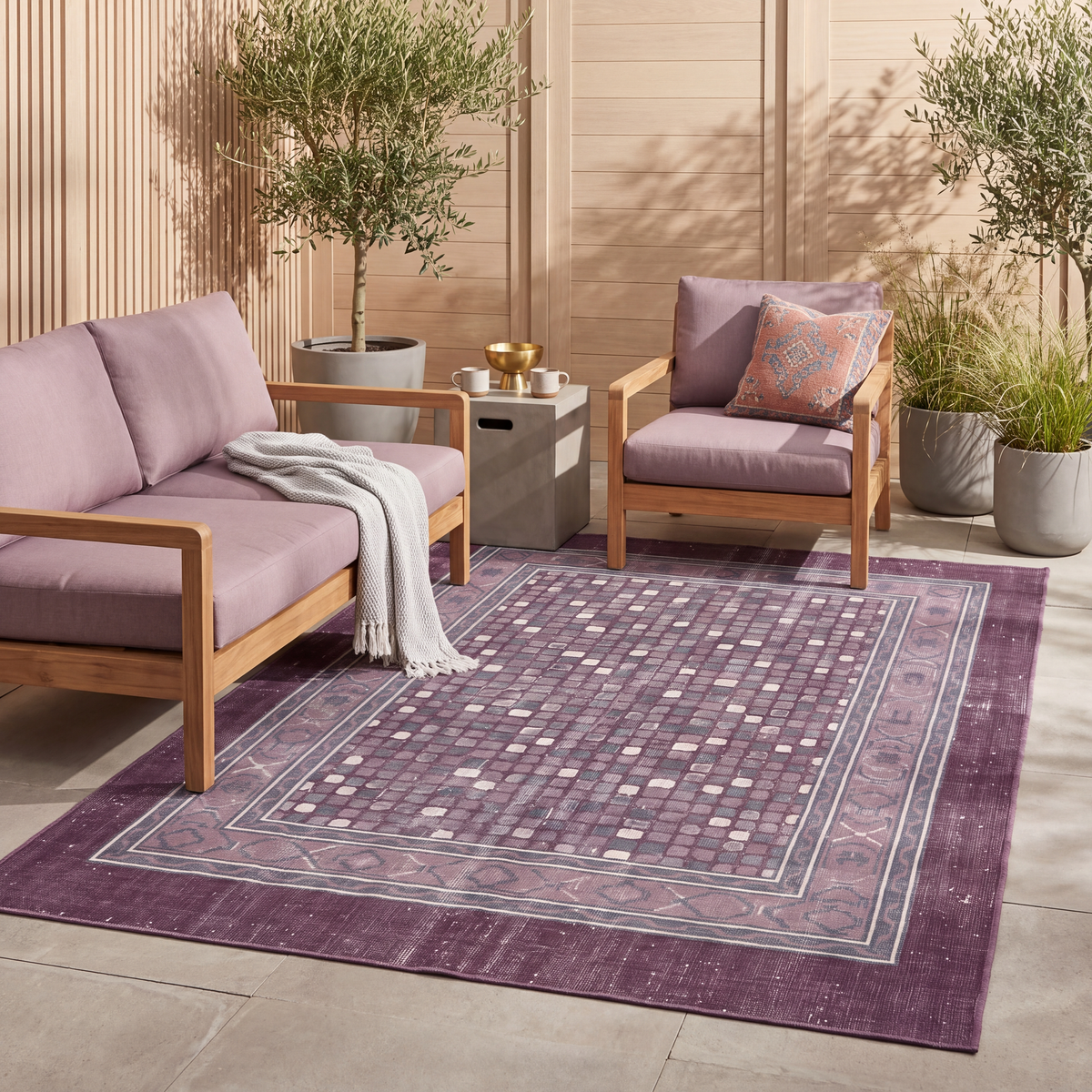 The rug laid flat on a patio beside outdoor seating.