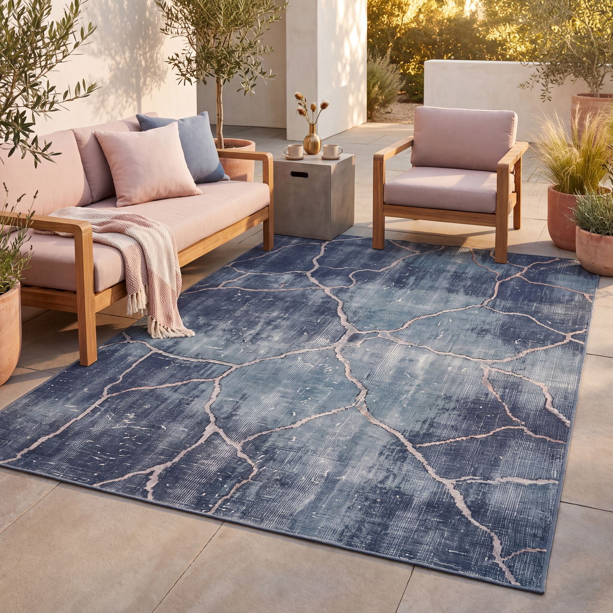 The rug laid flat on a patio beside outdoor seating.