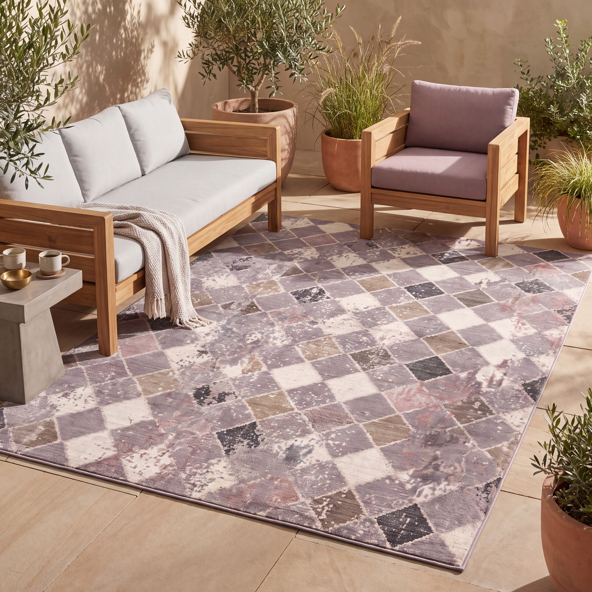The rug laid flat on a patio beside outdoor seating.