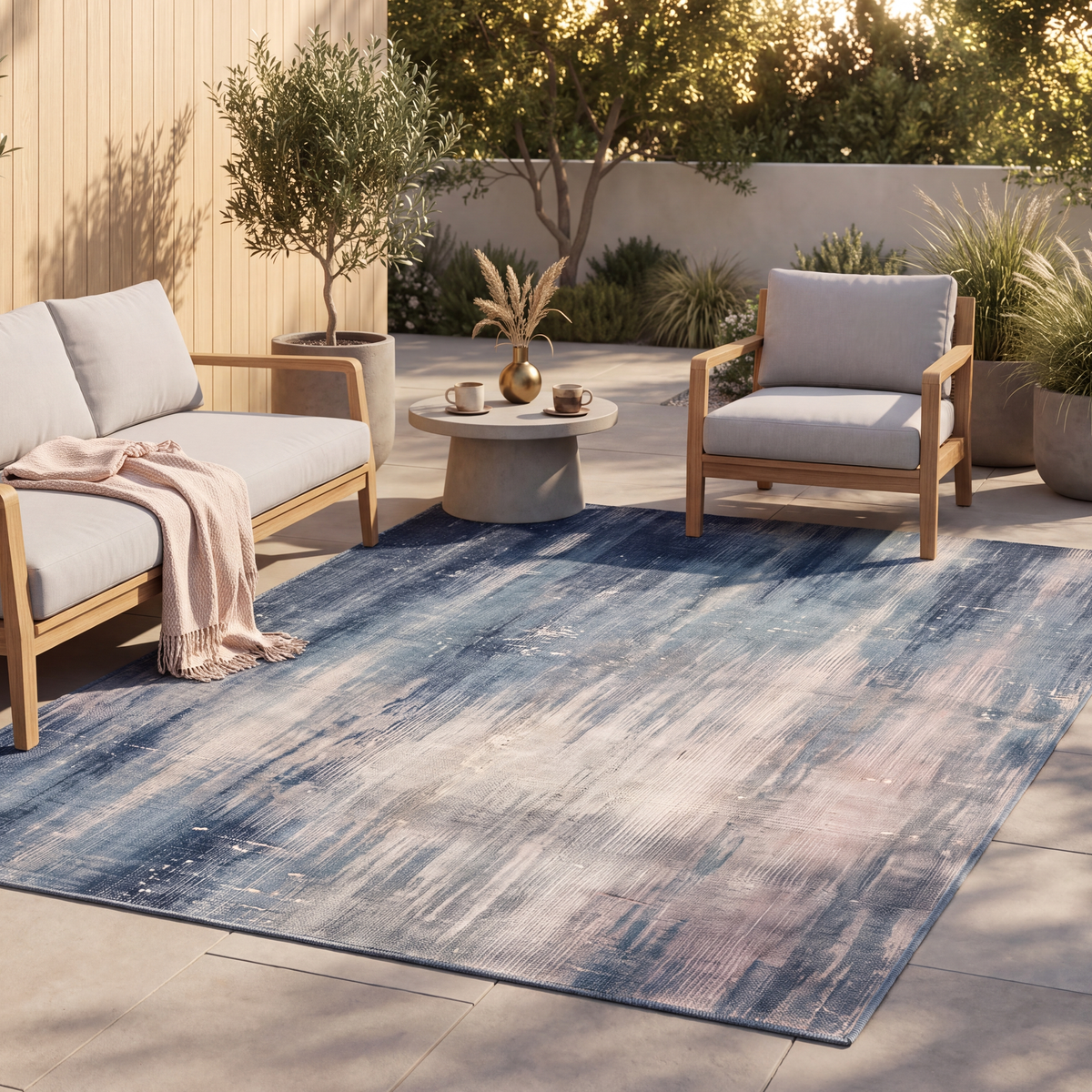 The rug laid flat on a patio beside outdoor seating.
