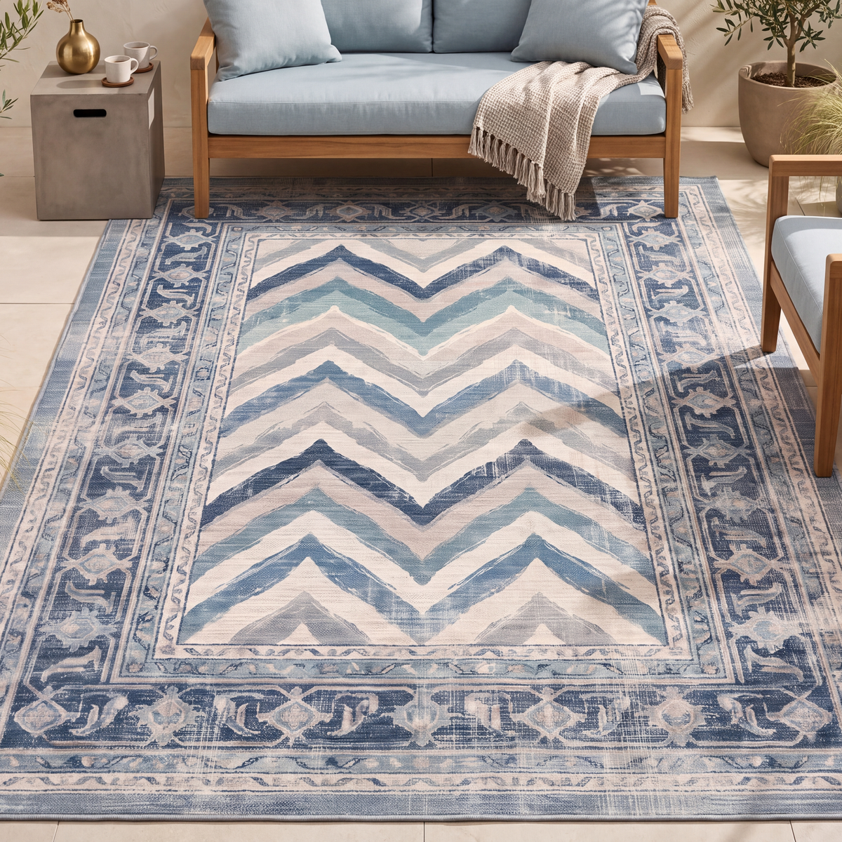 The rug laid flat on a patio beside outdoor seating.