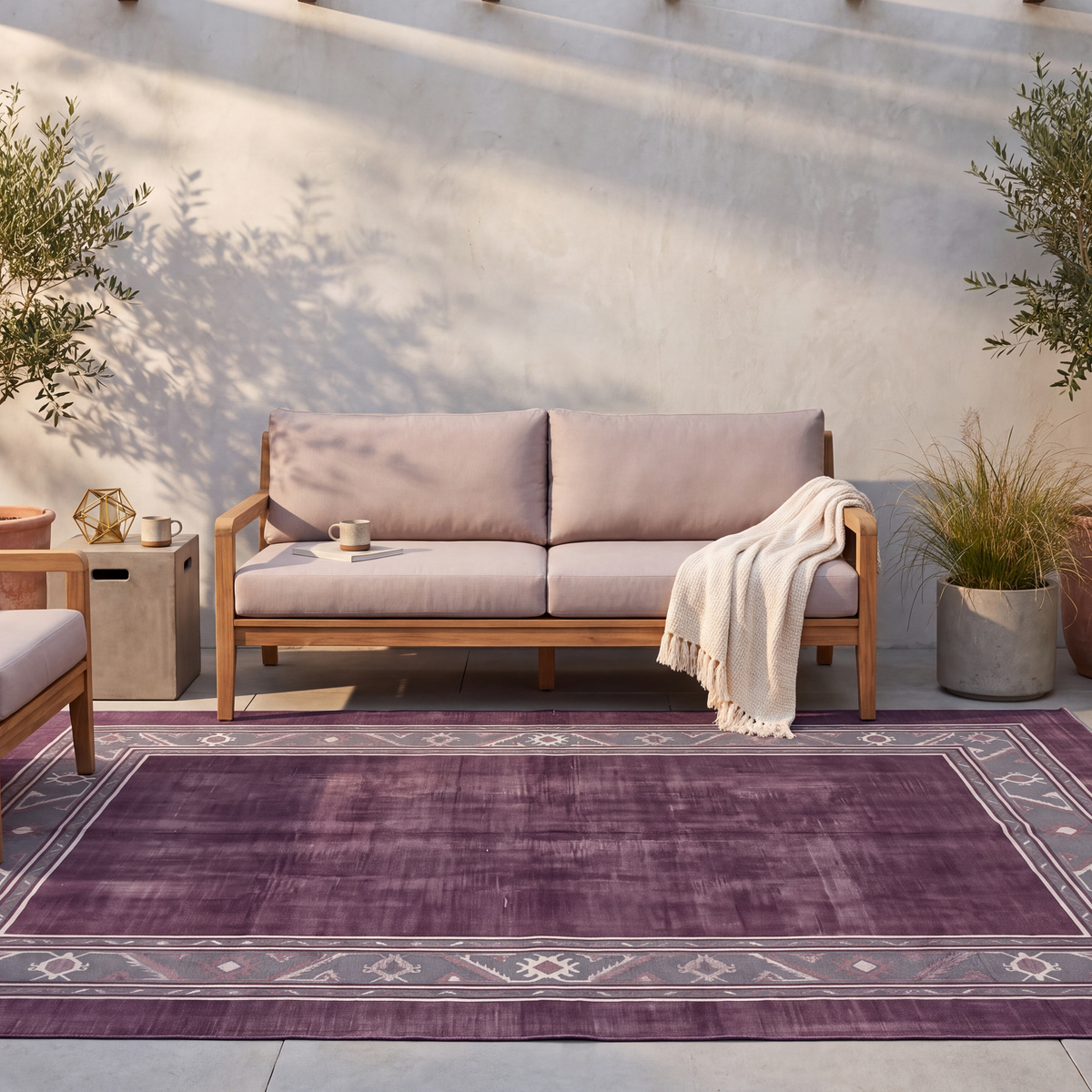 The rug laid flat on a patio beside outdoor seating.