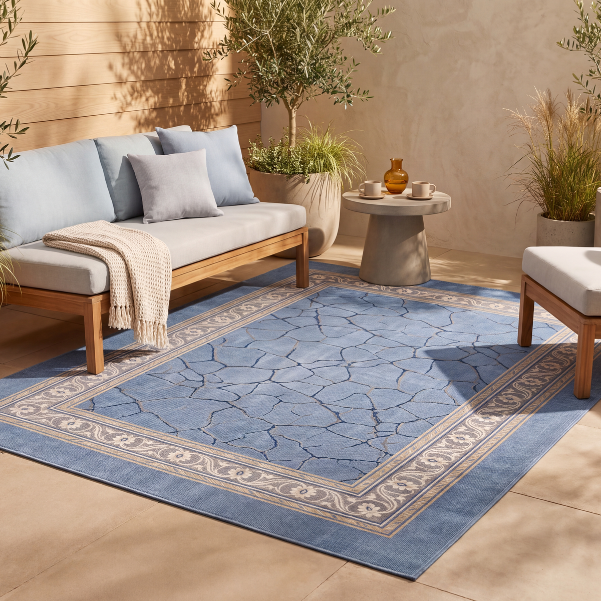 The rug laid flat on a patio beside outdoor seating.