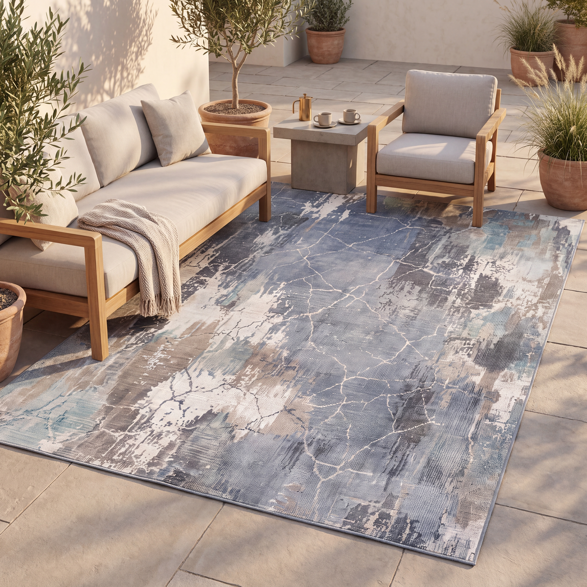 The rug laid flat on a patio beside outdoor seating.