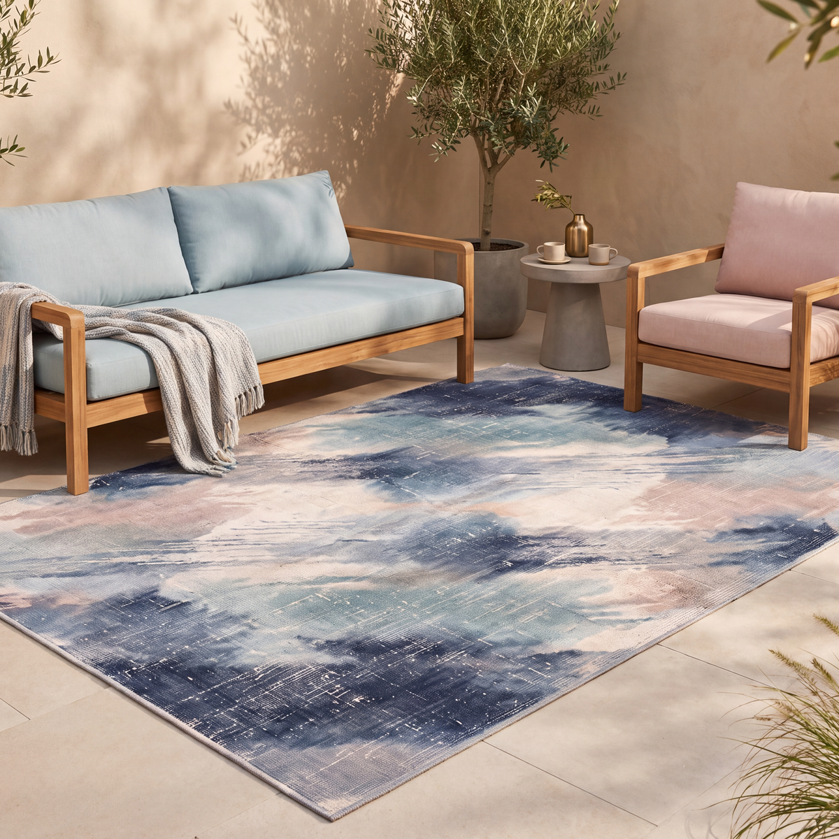 The rug laid flat on a patio beside outdoor seating.