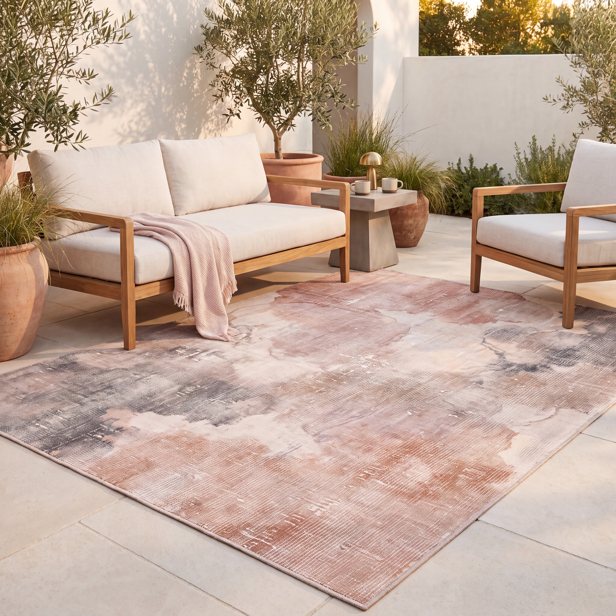 The rug laid flat on a patio beside outdoor seating.