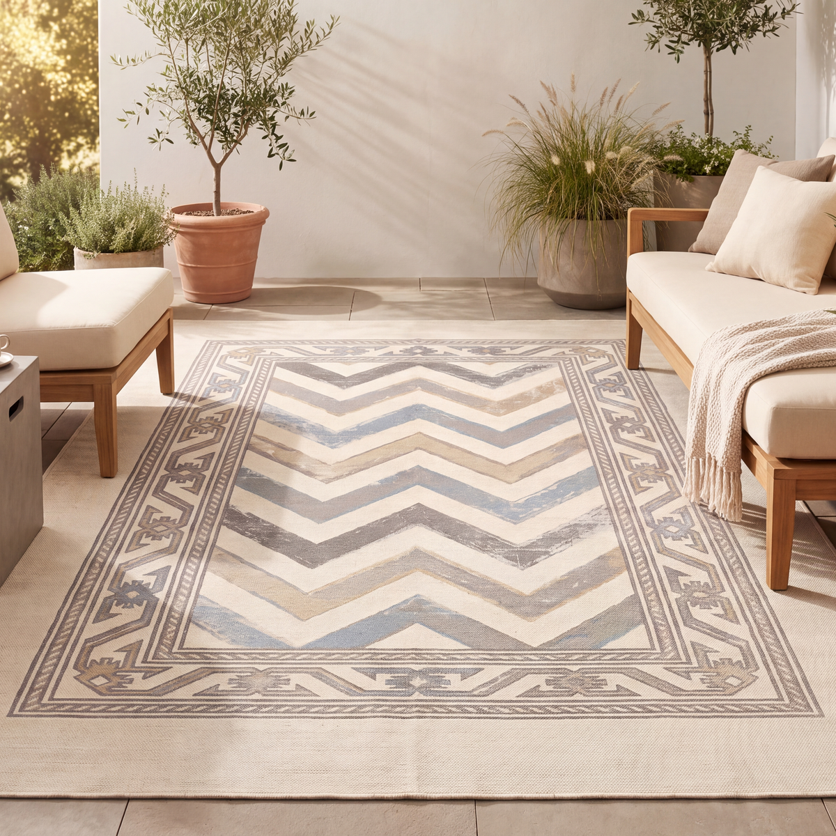 The rug laid flat on a patio beside outdoor seating.