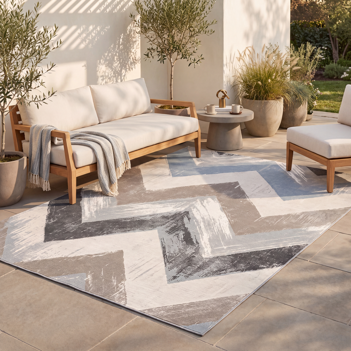 The rug laid flat on a patio beside outdoor seating.
