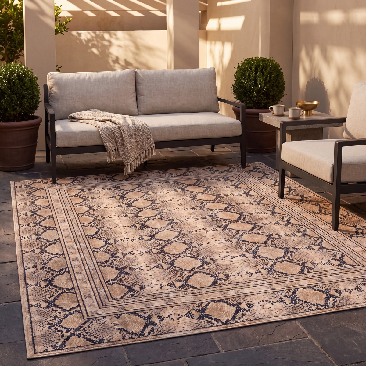 The rug laid flat on a patio beside outdoor seating.