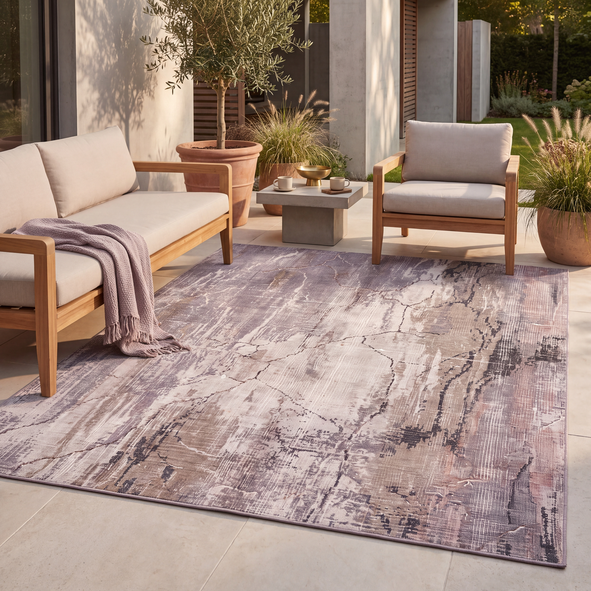 The rug laid flat on a patio beside outdoor seating.