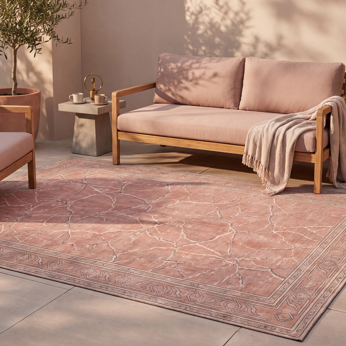 The rug laid flat on a patio beside outdoor seating.